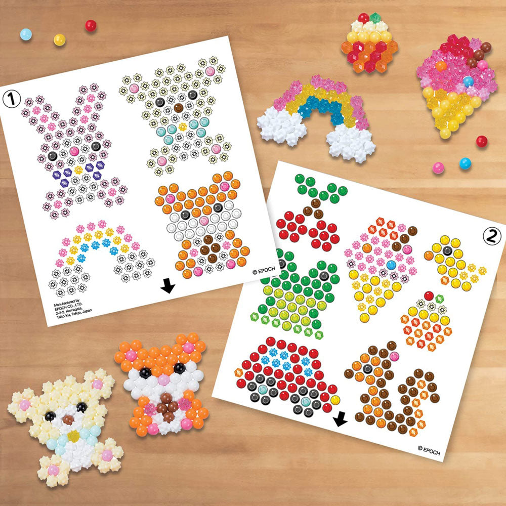 The Aquabeads Beginners Carry Case Bead Craft Kit comes with two template sheets to inspire you.