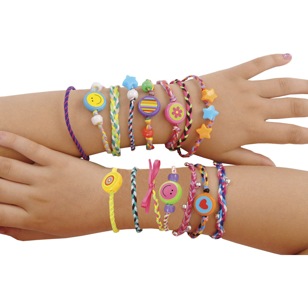 Create plaited and woven friendship bracelets with colourful threads, beads, ribbons.