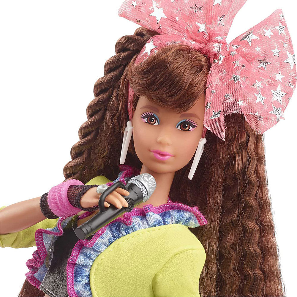 Barbie doll with chunky earrings, hot pink bangles and big hair with a bodacious bow accessory.